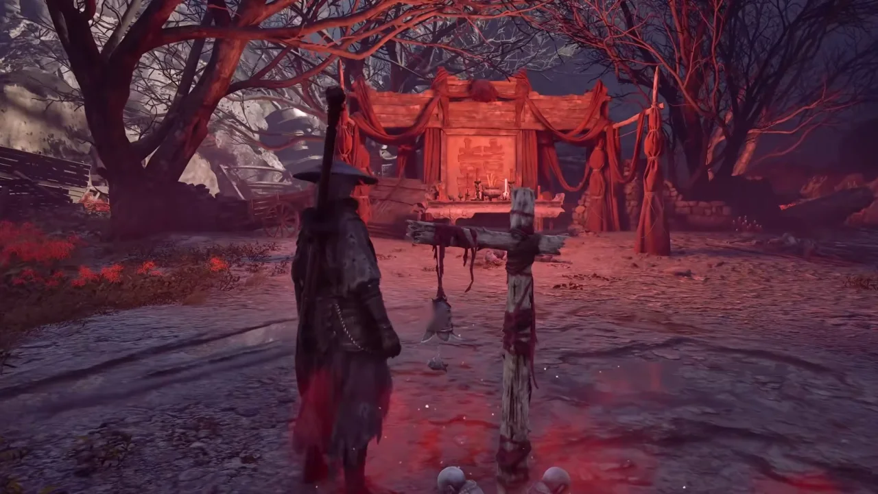 Soul beside the Flesh Lily Fields bell, a bell hanging from a red-wrapped wooden cross in front of the red-draped wedding shrine among bare crimson trees