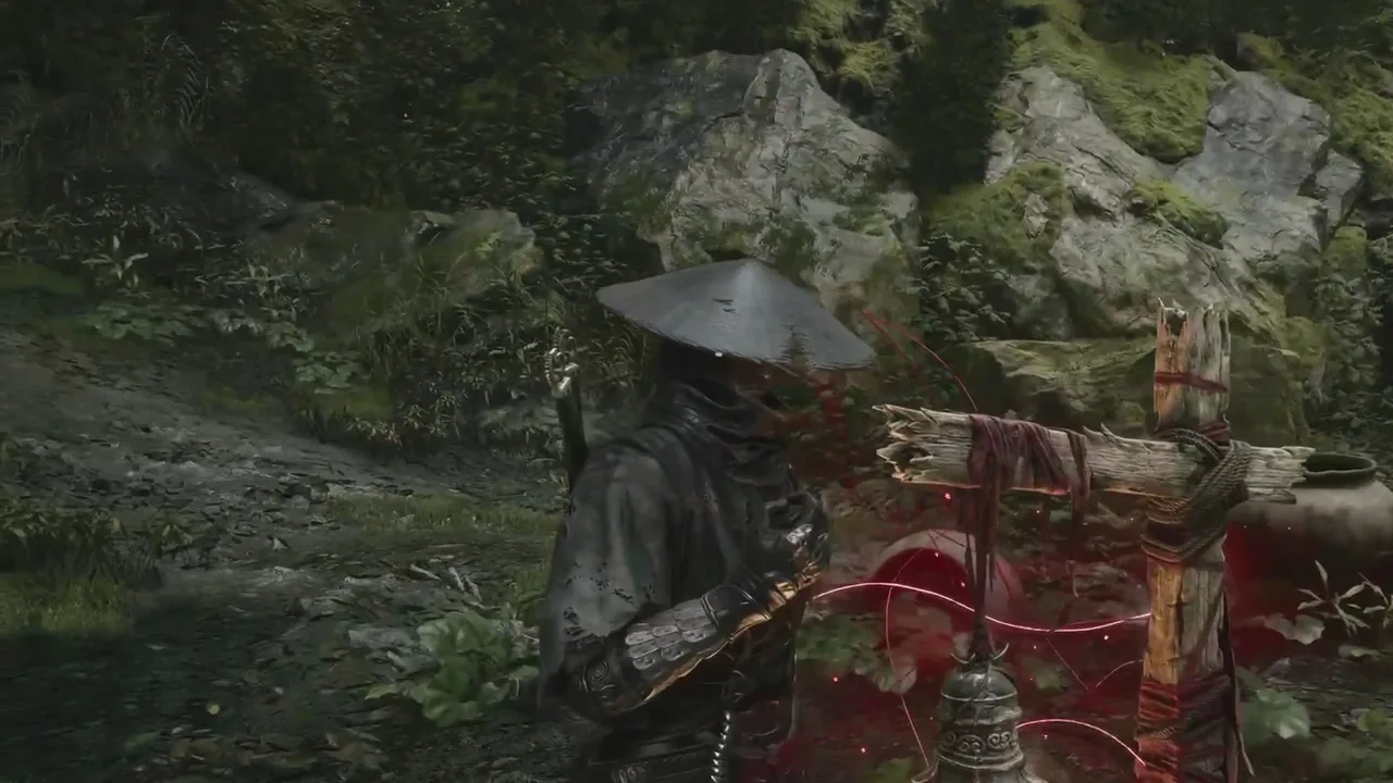 Soul ringing the Red Thread Barrier bell, a post wrapped in red thread among ferns at the foot of a mossy cliff