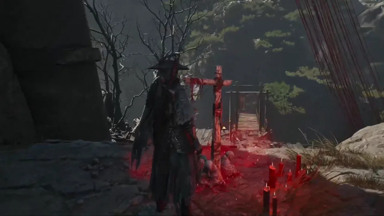 Soul beside the Waterfall Bridge bell, a red-wrapped post among red candles on a rocky ledge, a plank rope bridge and wooden gate behind it